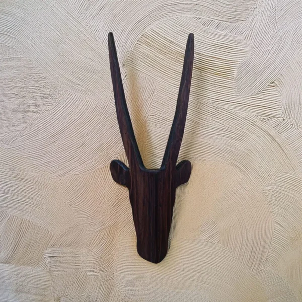 Dark-Brown-Wooden-Antelope-Heads-Wall-Art-on-textured-paint-wall-1000x1000.jpg Brown Wooden Antelope Heads Wall Art (Set of 3)